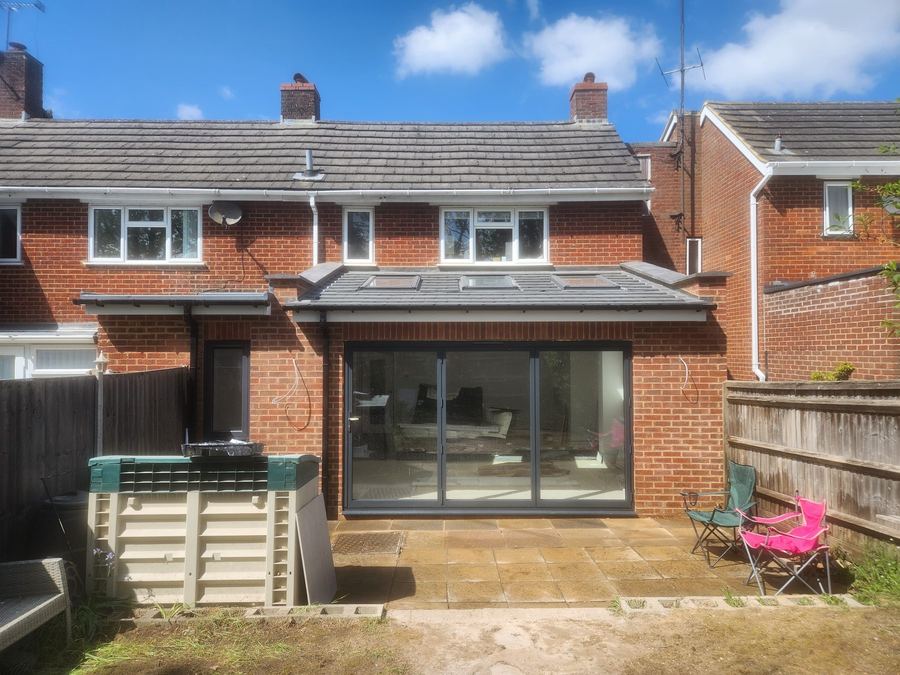 Single storey rear extension with grey bifold doors and roof lights